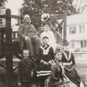 Photograph of a group of men, women, and children gathered on a bandstand in Hopkinton, New Hampshire, in 1889.