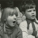 Children in black and white with a shocked look on their faces